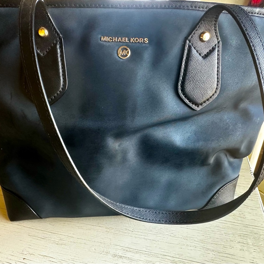 Michael Kohrs purse. Versatile easy to clean